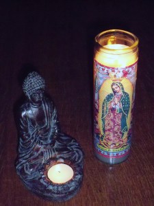 Prayer candles from Buddist and Catholic traditions
